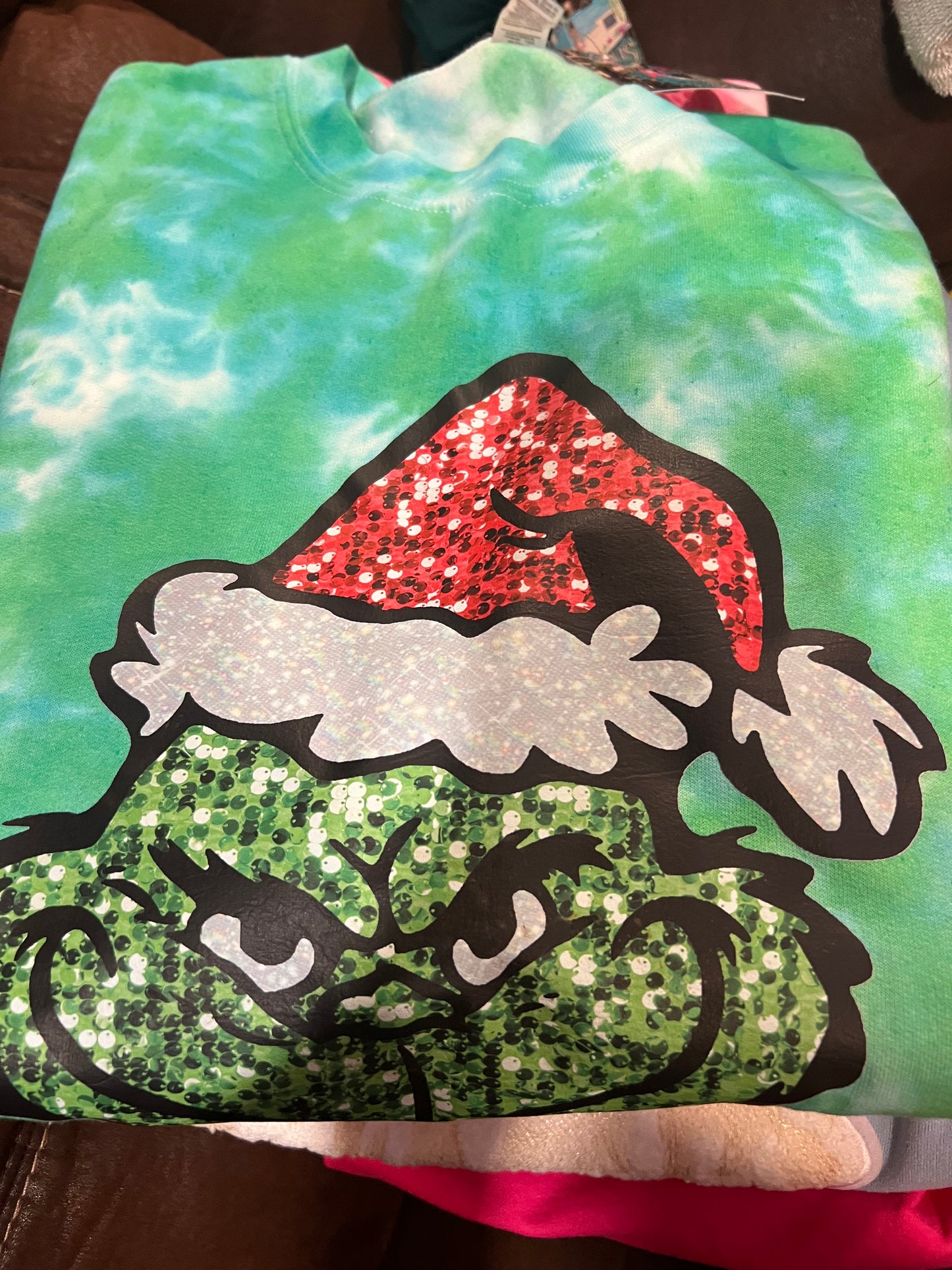 lime green tye dye sweathirt grinchy man red hat