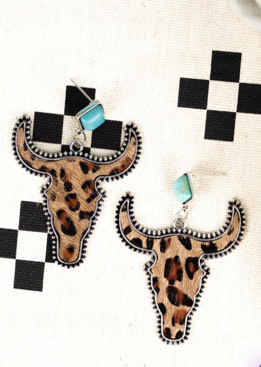 Turquoise ranch leopard steer